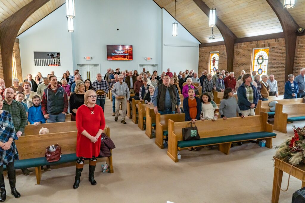 The Riverside Congregation stands and sings during a service in the sanctuary