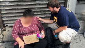 Praying with a homeless woman Praying with a homeless woman