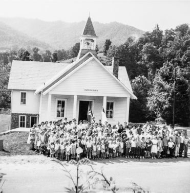 VBS Students and Teachers stand outside the church building